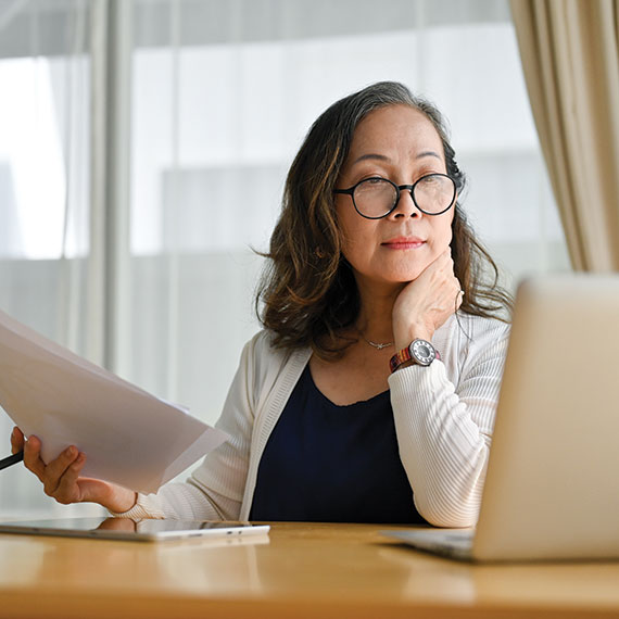 A woman researching planned giving options. Links to Gifts of Appreciated Securities securities.jpg